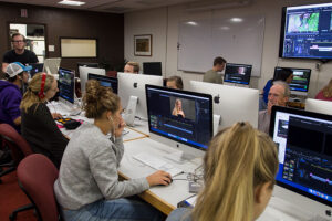 Luther students editing videos in a computer lab at the Digital Media Center