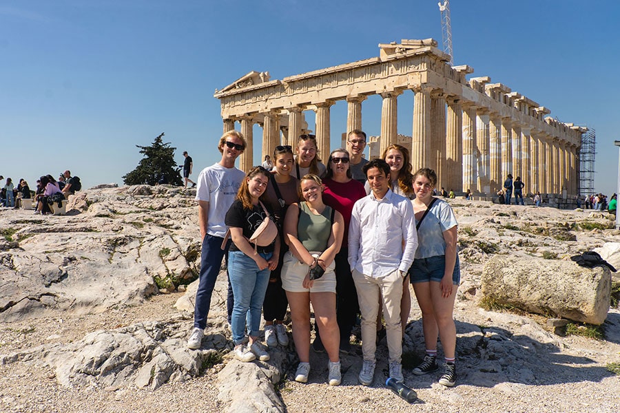 Luther students standing in front of temple ruins in Greece