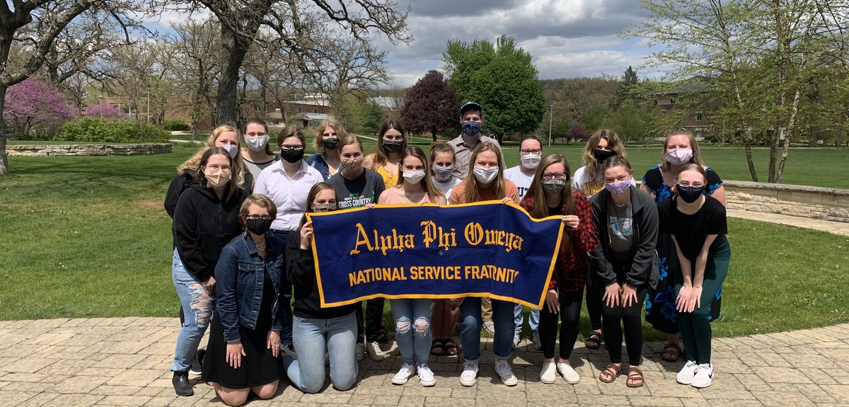 members of Alpha Phi Omega pose for a group photo