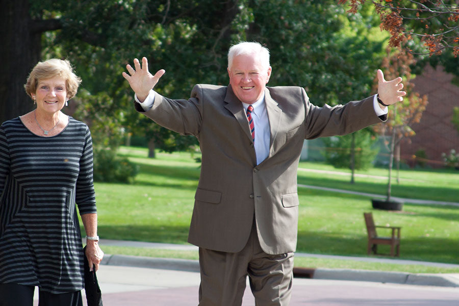 Former Luther president Rick Torgerson walks across the Luther campus with his wife, Judy