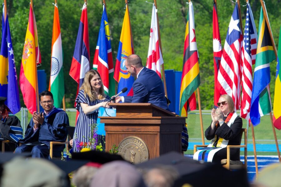 Amanda receives her award on stage at commencement.