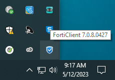 An image of the Windows system tray, which shows applet icons, including the blue shield icon for the FortiClient VPN
