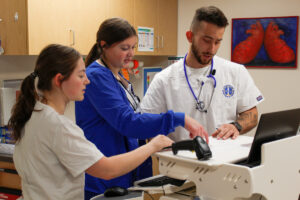 Three nursing students working in the Nursing Simulation Center at Luther College.