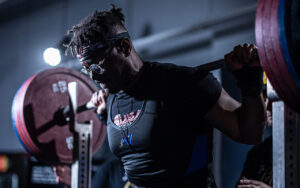 Jaden Bilal lifting in a gym. 