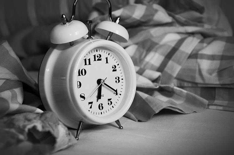 black and white photo of alarm clock